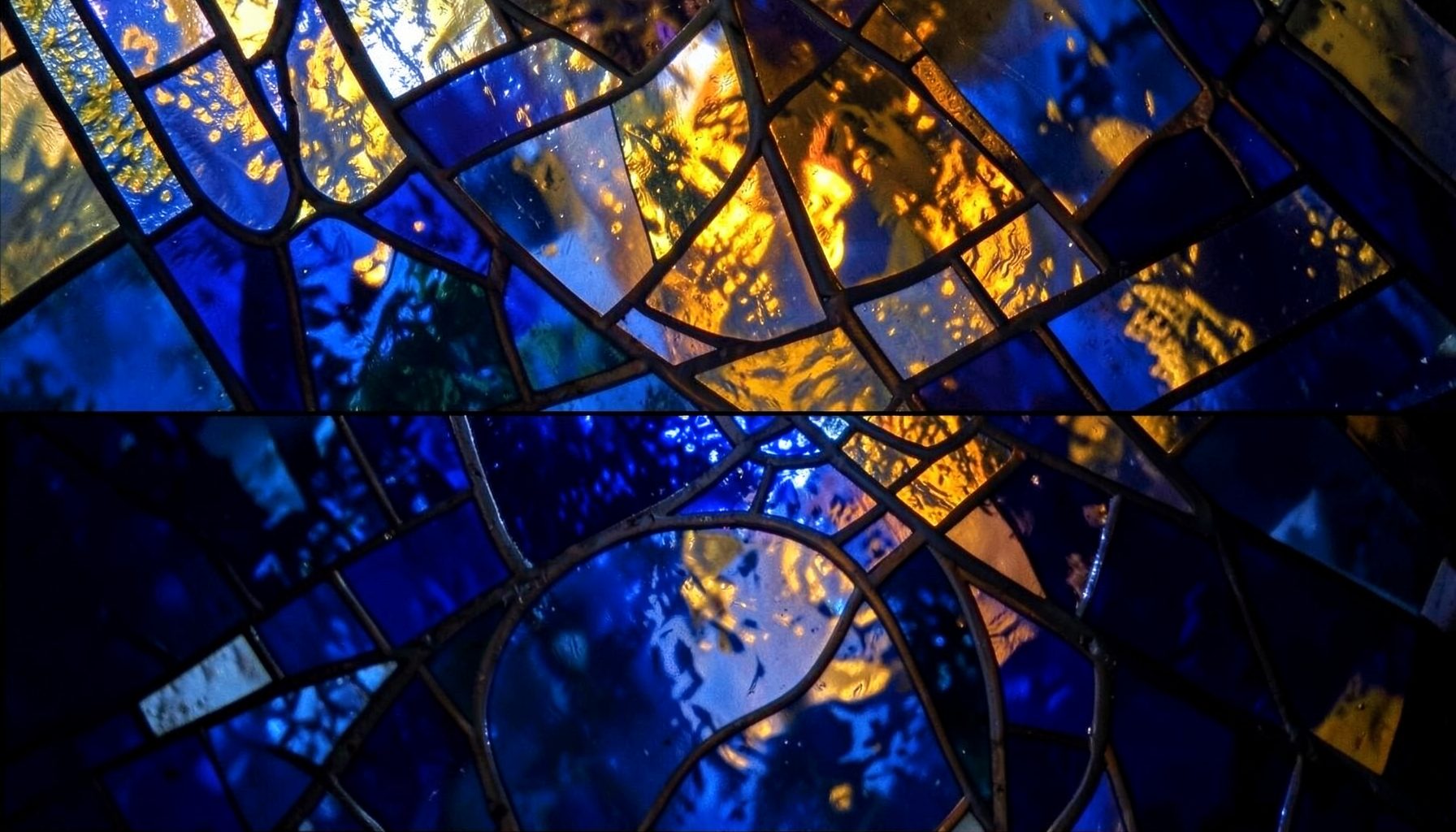 Abstract composition in deep blues and warm golds, evoking stained glass and quiet spiritual contemplation